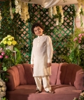 Qanari Embroidered Yellow Nehru Jacket Paired With Cream Kurta & Trouser Set 
