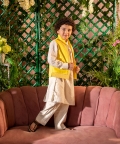 Qanari Embroidered Yellow Nehru Jacket Paired With Cream Kurta & Trouser Set 